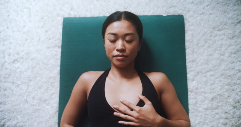 A woman practice diaphragmatic breathing